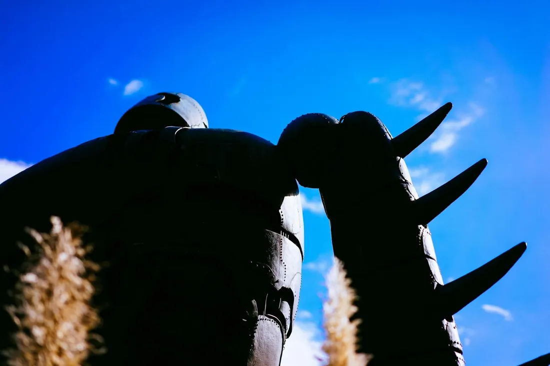 Silhouette of the Laputa robot soldier against a blue sky on the museum roof, the icon travelers with Ghibli Museum tickets climb up to see