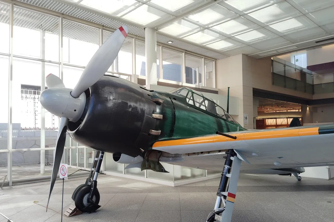 The restored Mitsubishi Zero fighter on display in the entrance hall of the Yushukan museum in Tokyo
